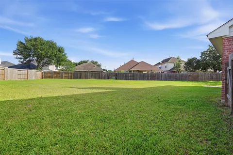 a view of a green field with clear sky