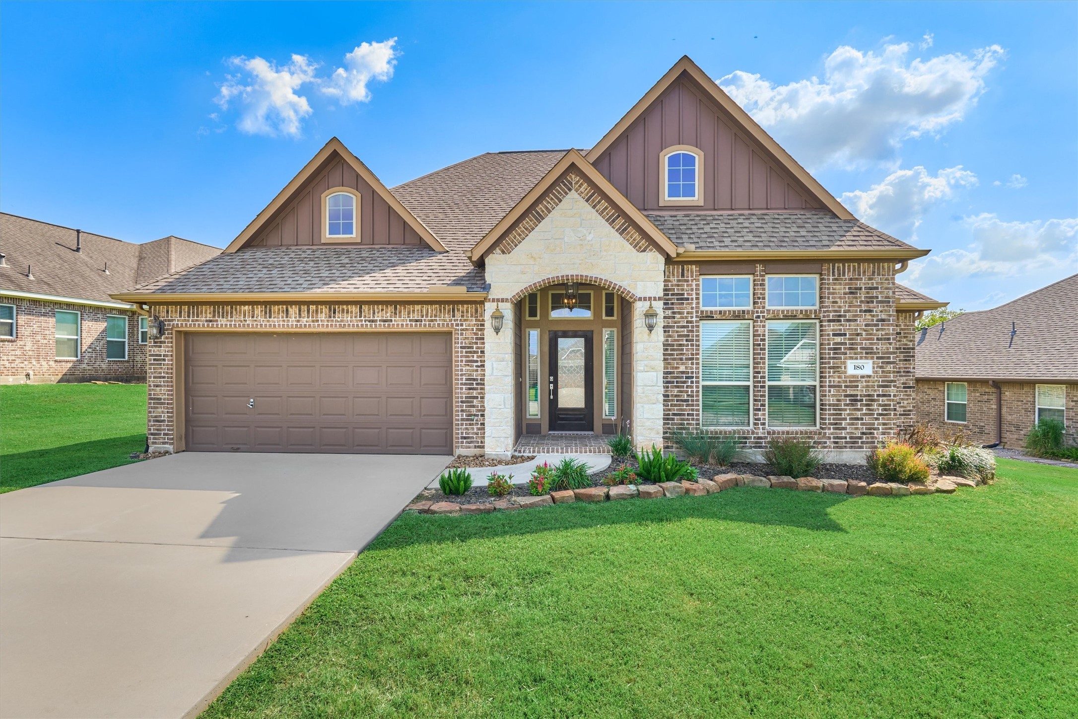 180 Racetrack Lane Montgomery, TX 77356 - Photo 7 of 46 Pretty curb appeal with double wide drive and two car garage.