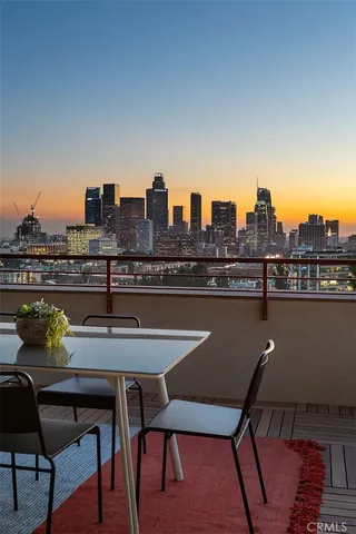 a terrace with a table and chairs