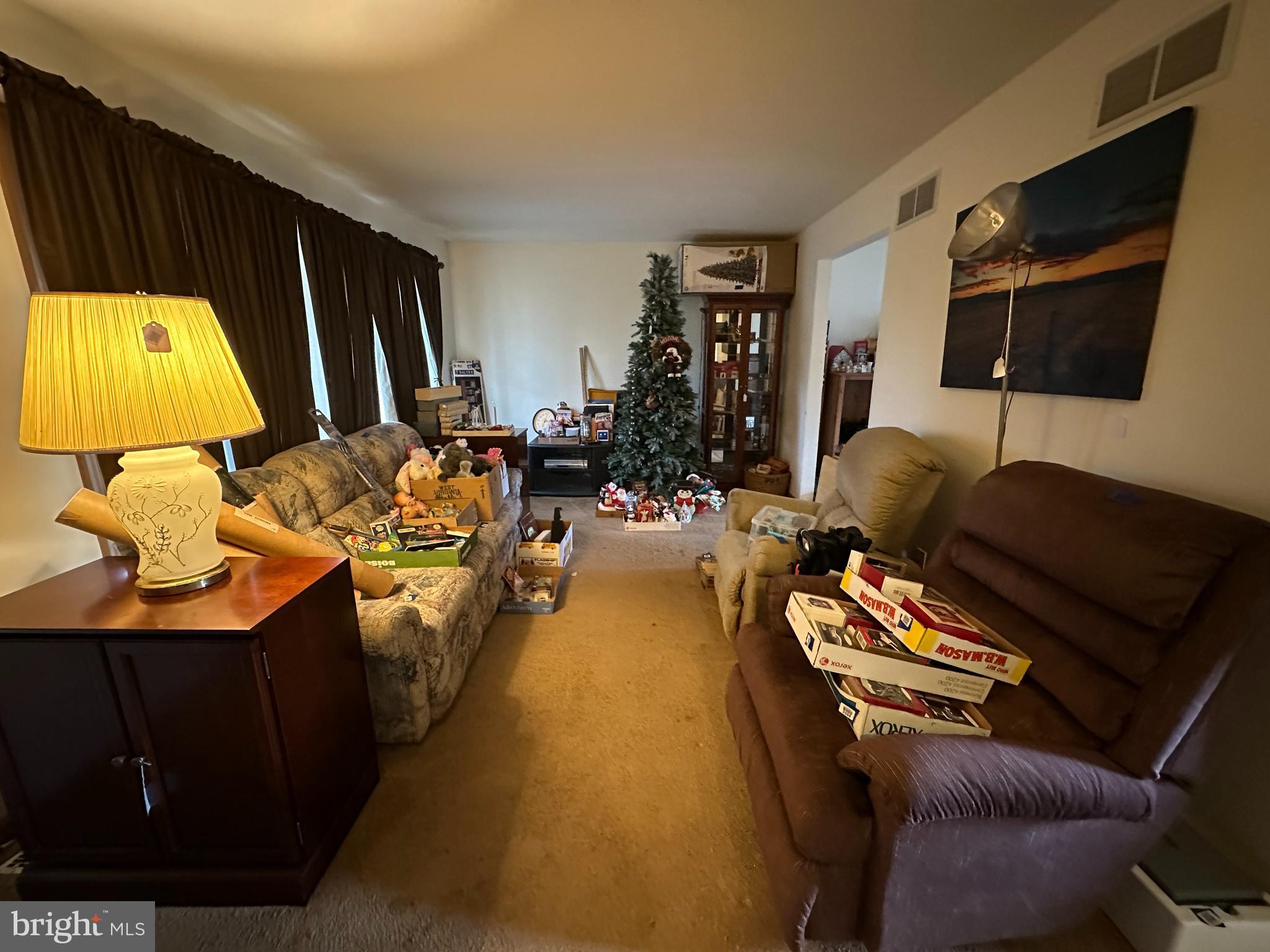 12103 Itnyre Road Smithsburg, MD 21783 - Photo 42 of 84 a living room with furniture and a flat screen tv