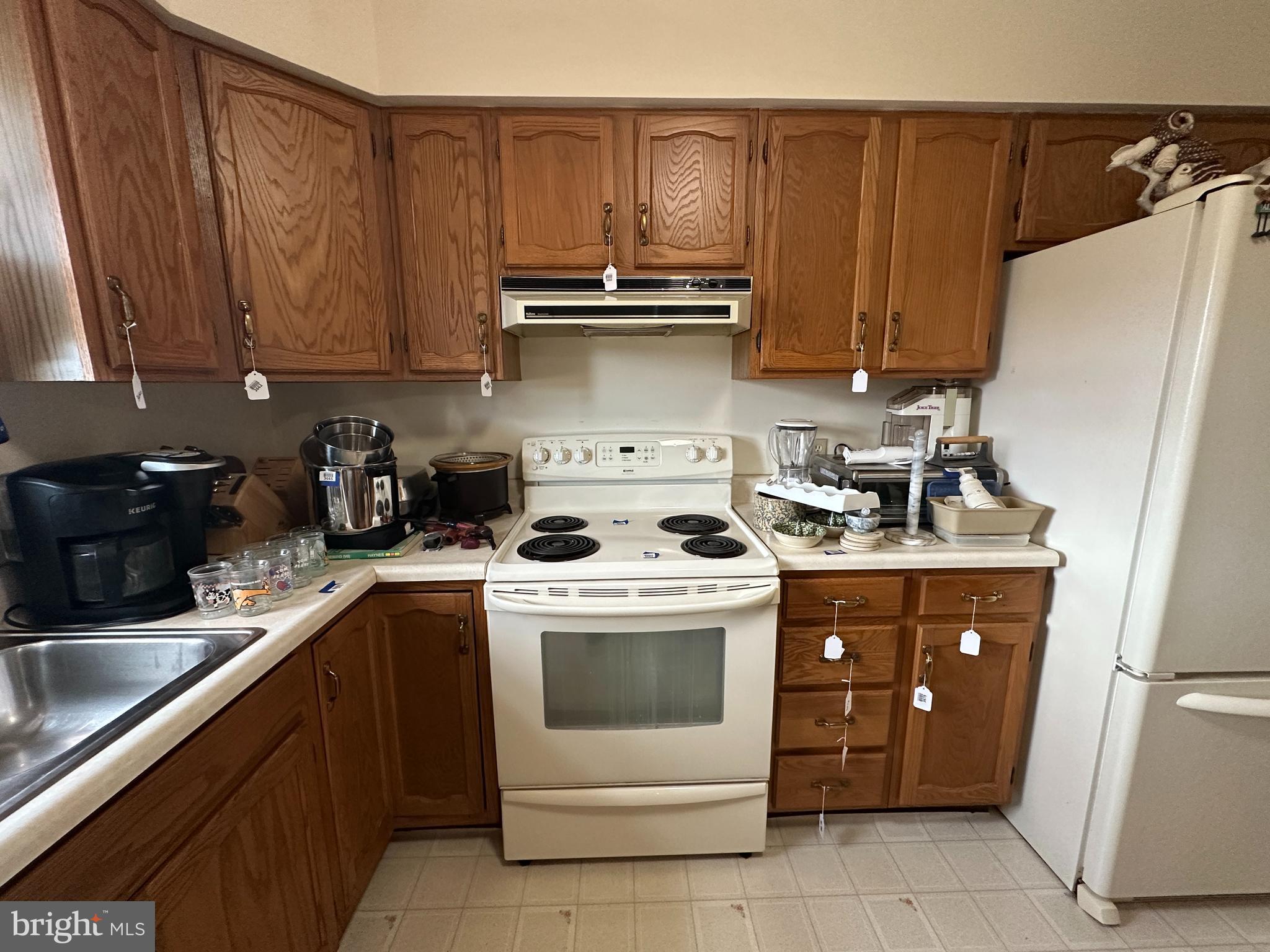 12103 Itnyre Road Smithsburg, MD 21783 - Photo 47 of 84 a kitchen with a stove top oven sink and cabinets