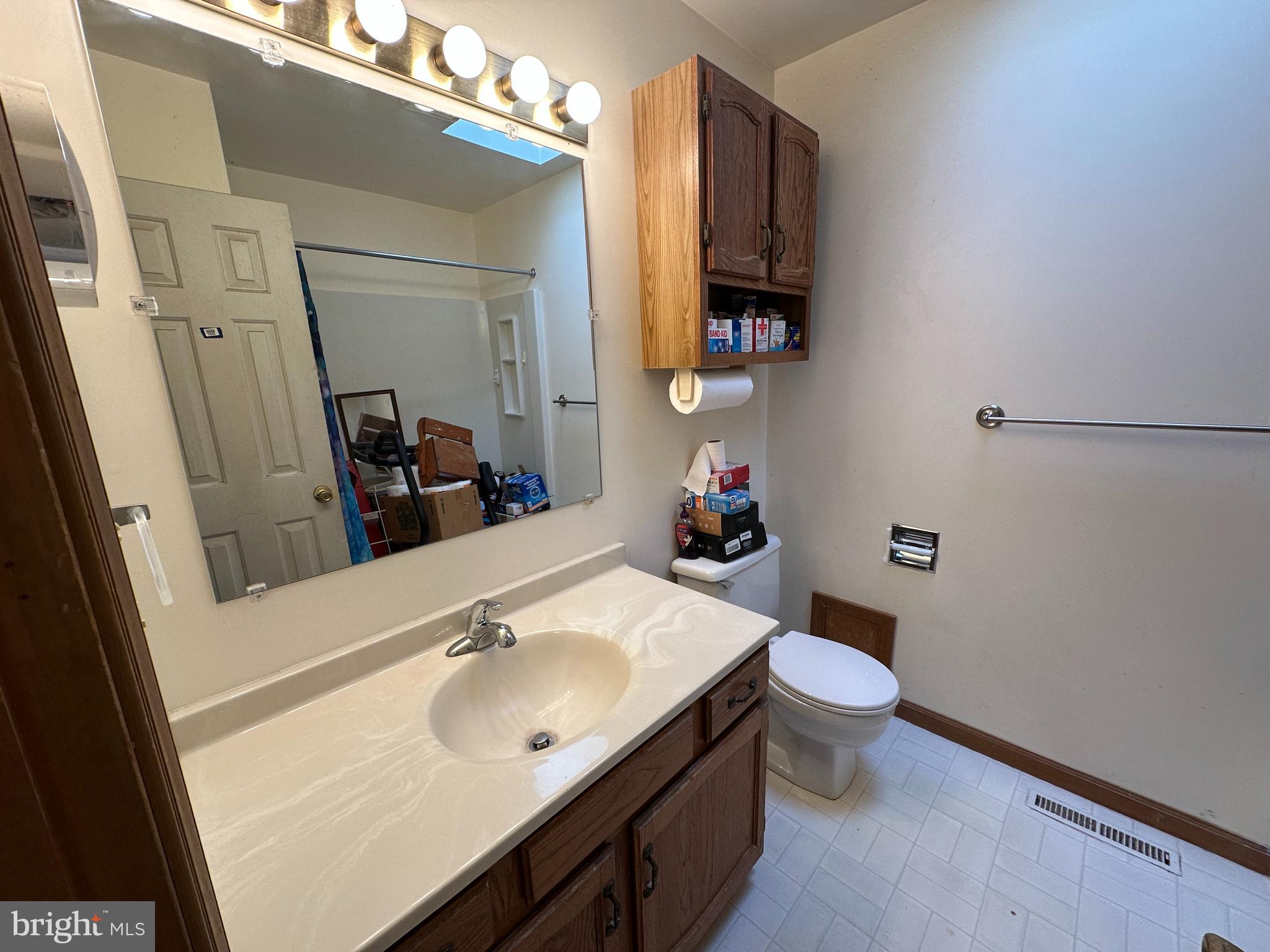 12103 Itnyre Road Smithsburg, MD 21783 - Photo 62 of 84 a bathroom with a sink toilet and mirror