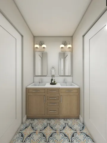 a bathroom with a double vanity sink mirror and