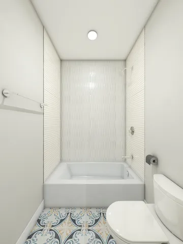a bathroom with a toilet and a bathtub