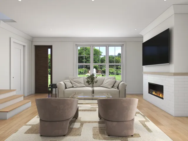 a living room with couches a coffee table and a flat screen tv