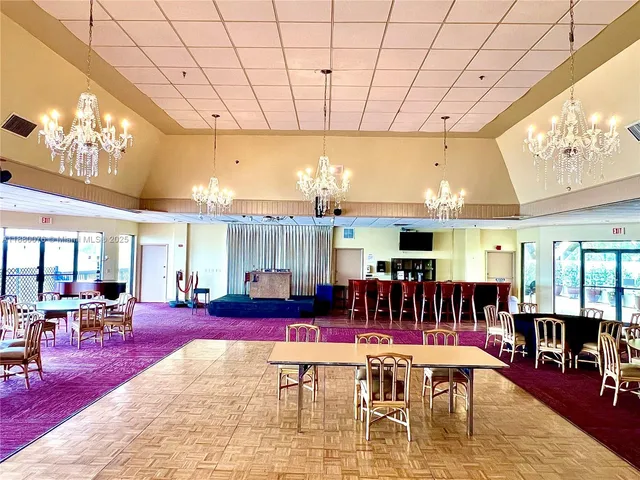 a living room with furniture a table and chairs