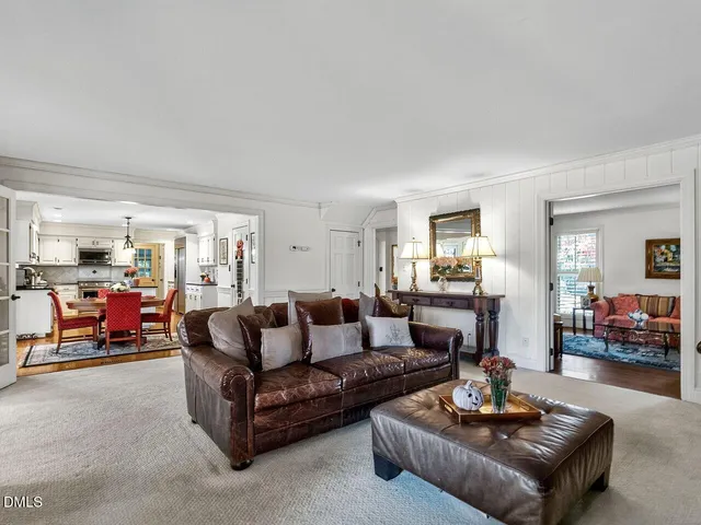 a kitchen with a dining table and chairs