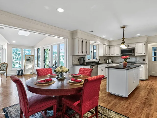 a view of a dining room with furniture and wooden floor