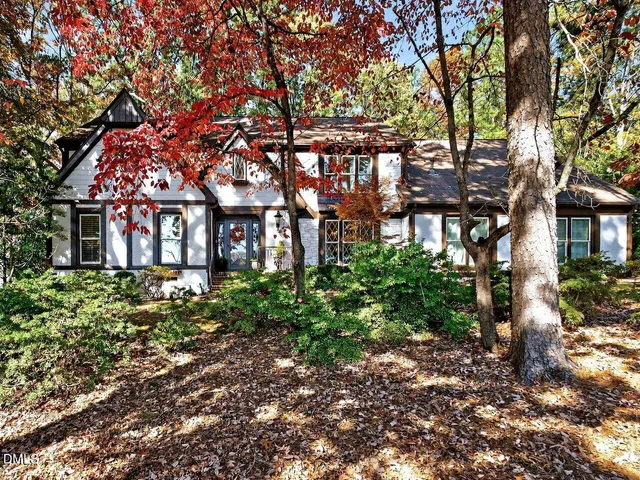 front view of a house with a tree