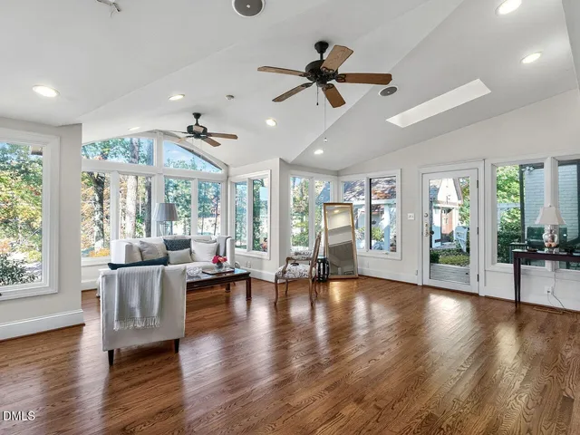 a bathroom with a sink vanity mirror and toilet