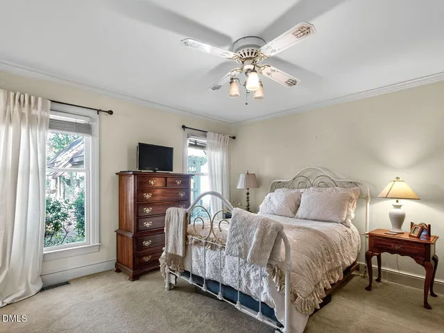 a bedroom with furniture and a window