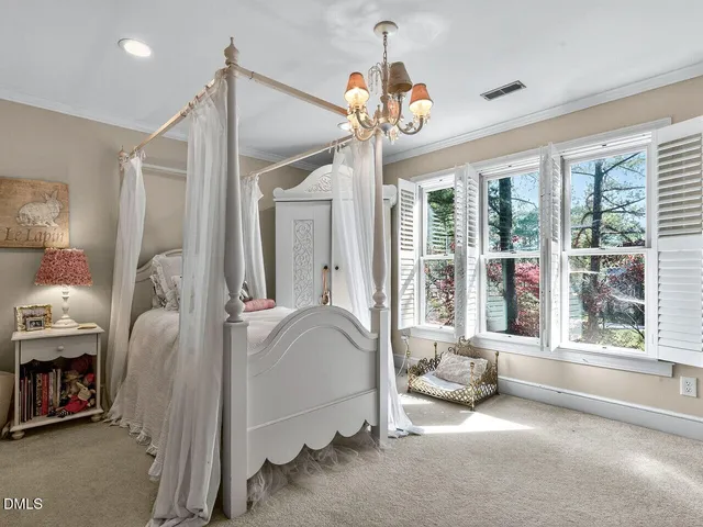 a living room with couches and pool view with wooden floor