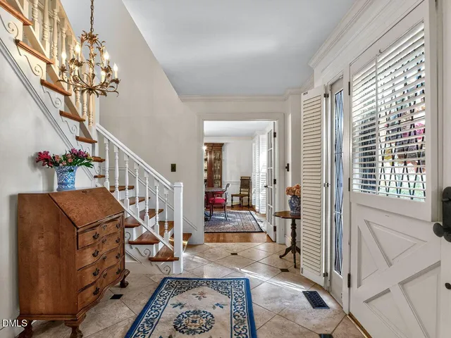 a view of a livingroom with furniture and staircase