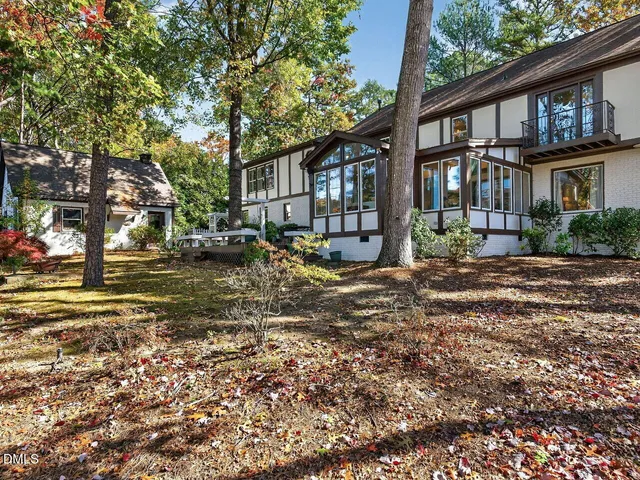 a view of a brick house with a yard
