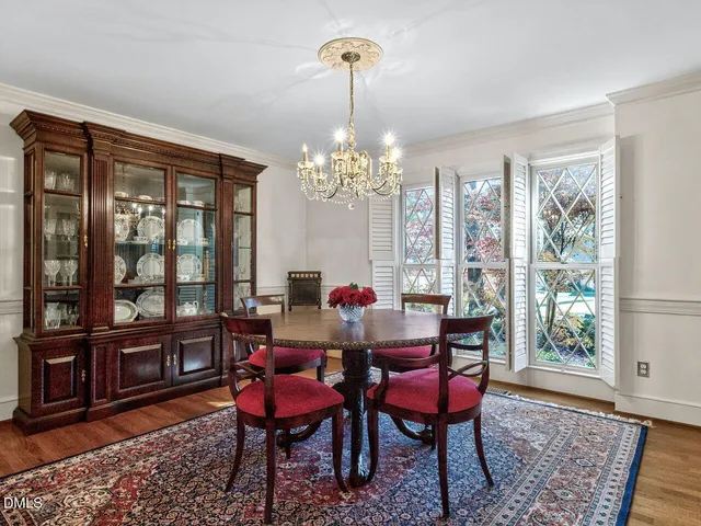 a living room with furniture large window and a fireplace