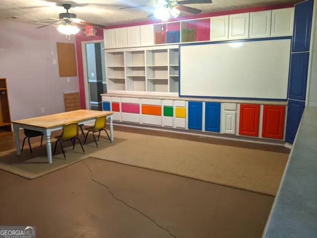 a room with pool table and chandelier
