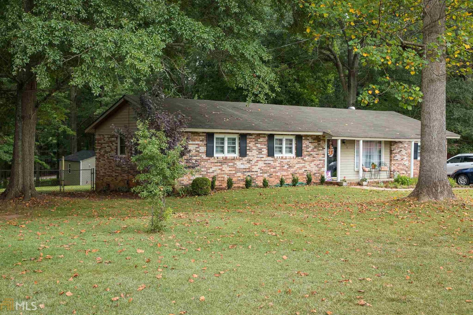 290 Fallin Street Thomaston, GA 30286 - Photo 1 of 1 a front view of a house with garden