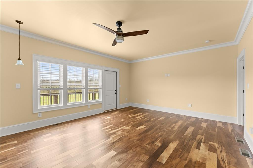 725 County Farm Road Jefferson, GA 30549 - Photo 26 of 66 a view of empty room with wooden floor and fan