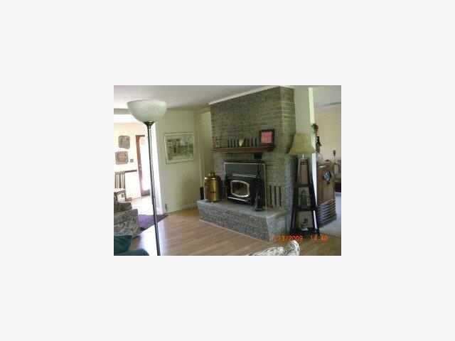 60 Webb Road Watsonville, CA 95076 - Photo 2 of 9 a living room with furniture and a fireplace