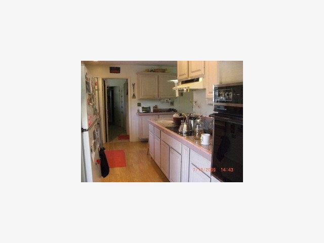 60 Webb Road Watsonville, CA 95076 - Photo 3 of 9 a kitchen with a sink and refrigerator