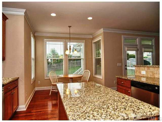 2736 Royal Forrest Drive Raleigh, NC 27614 - Photo 6 of 22 The center island has electricity and overlooks the sunny breakfast room! Kitchen