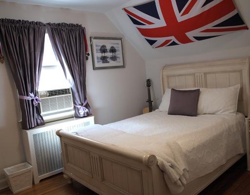97 Pemberwick Road Greenwich, CT 06831 - Photo 6 of 6 a bedroom with a bed and wooden floor