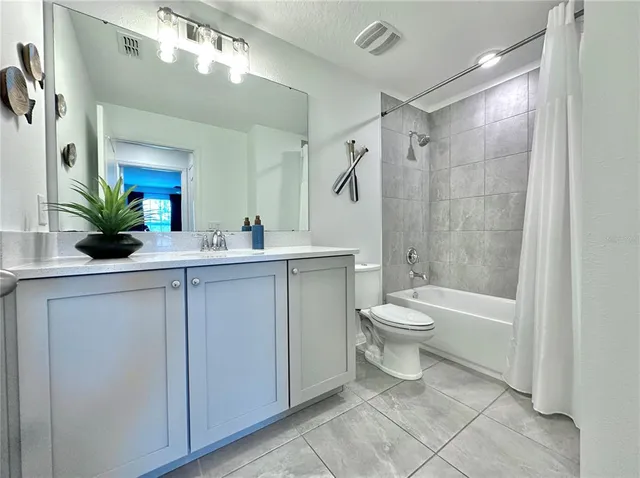 a view of a house with yard and sitting area