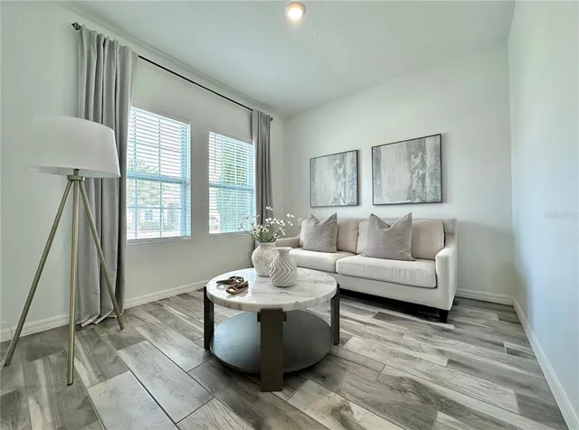 a living room with furniture and a window