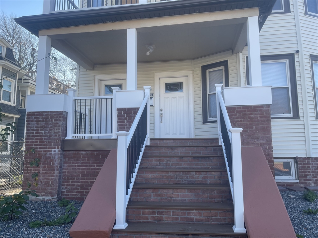 1002 River Street, Unit 3 Boston, MA 02136 - Photo 11 of 11 a front view of a house with wooden stairs