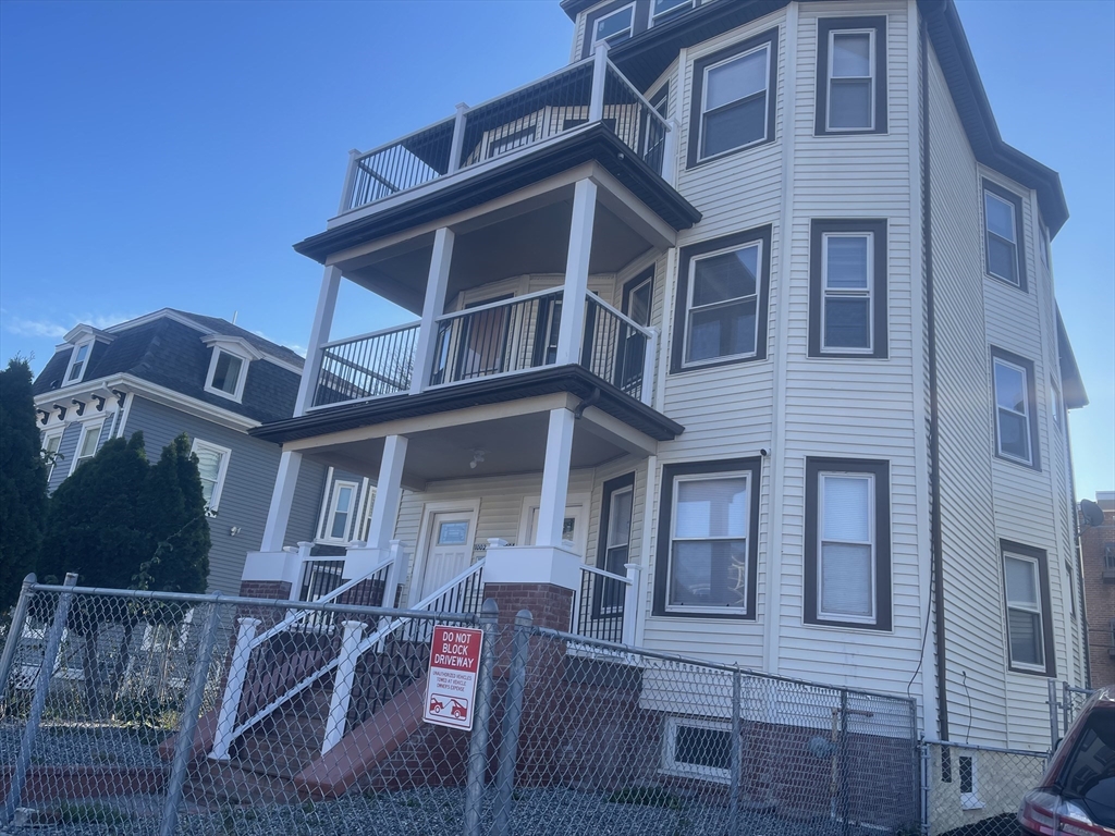 1002 River Street, Unit 3 Boston, MA 02136 - Photo 2 of 11 a front view of a house with balcony
