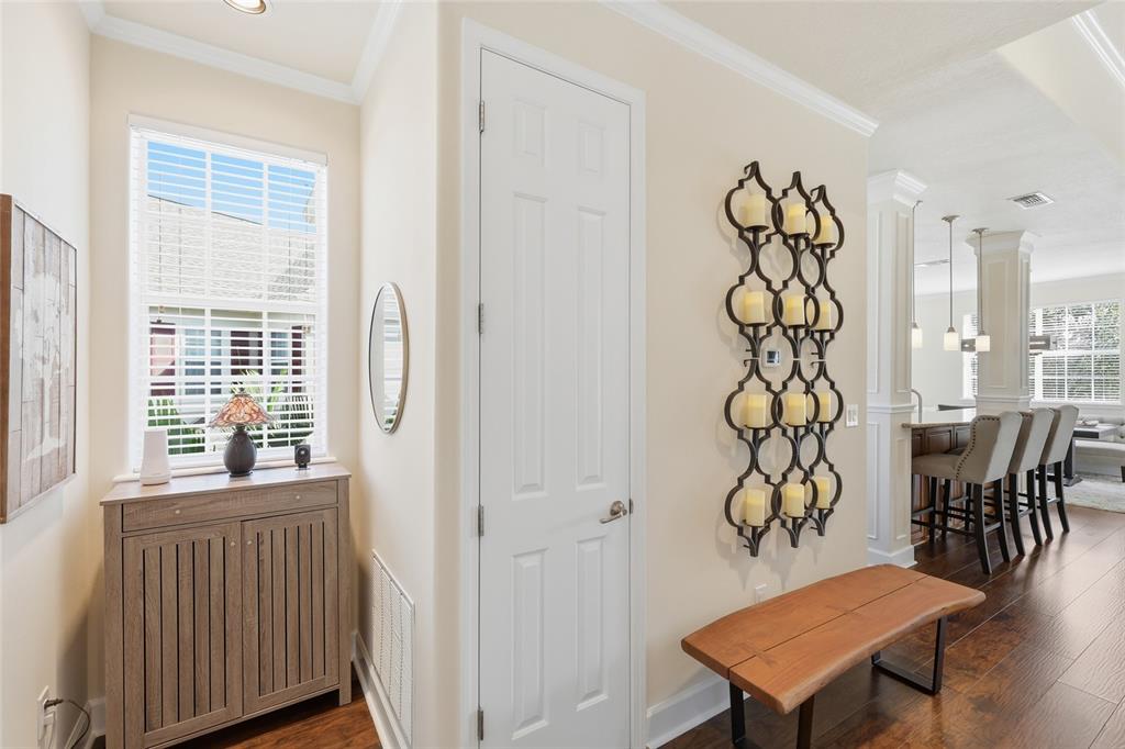 8063 St Simons Street, Unit 8063 University Park, FL 34201 - Photo 11 of 29 a view of a livingroom and a dining room with windows wooden floor and a table