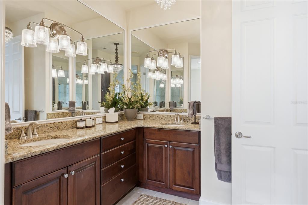8063 St Simons Street, Unit 8063 University Park, FL 34201 - Photo 16 of 29 a bathroom with a granite countertop sink mirror and double
