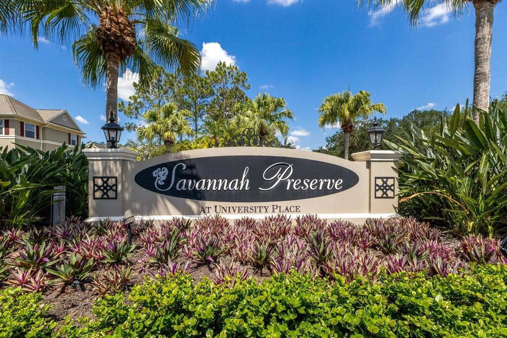 8063 St Simons Street, Unit 8063 University Park, FL 34201 - Photo 25 of 29 a sign broad in front of flowers