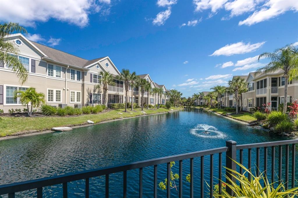 8063 St Simons Street, Unit 8063 University Park, FL 34201 - Photo 26 of 29 a view of lake with a house in the background