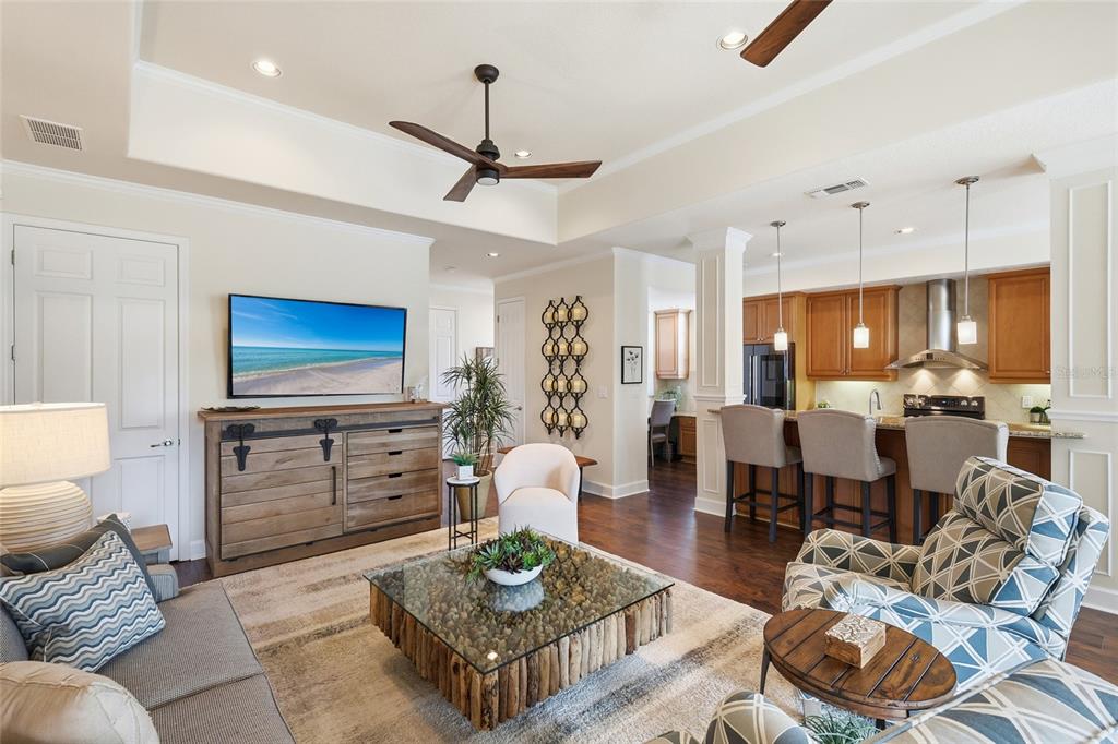 8063 St Simons Street, Unit 8063 University Park, FL 34201 - Photo 3 of 29 a living room with furniture a rug and a chandelier