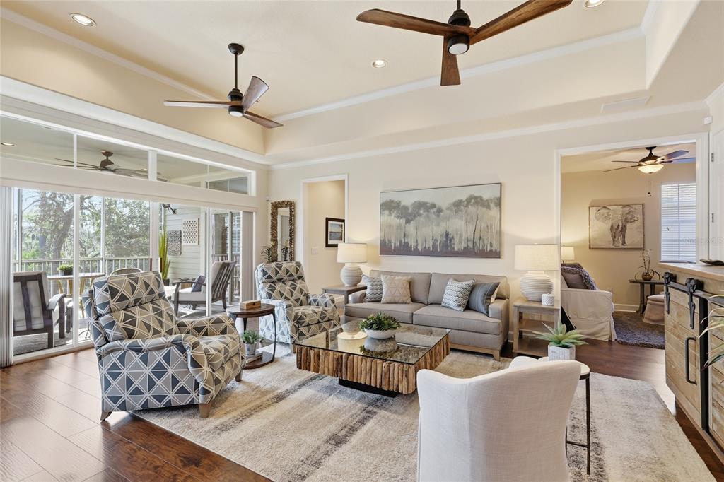 8063 St Simons Street, Unit 8063 University Park, FL 34201 - Photo 4 of 29 a living room with furniture and a ceiling fan