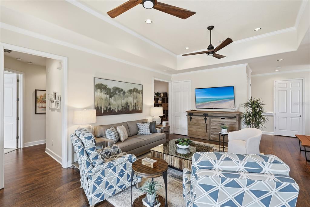 8063 St Simons Street, Unit 8063 University Park, FL 34201 - Photo 5 of 29 a living room with furniture and a flat screen tv