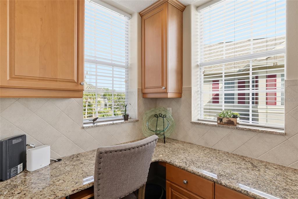 8063 St Simons Street, Unit 8063 University Park, FL 34201 - Photo 9 of 29 a kitchen with a window a sink and cabinets