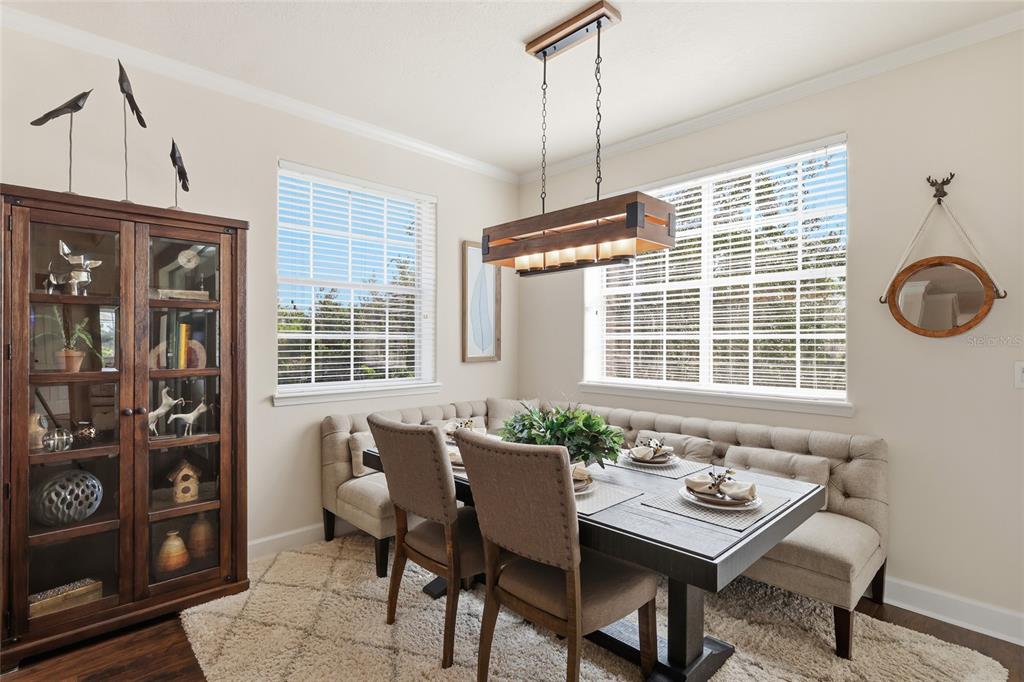 8063 St Simons Street, Unit 8063 University Park, FL 34201 - Photo 10 of 29 a view of a dining room with furniture window and outside view