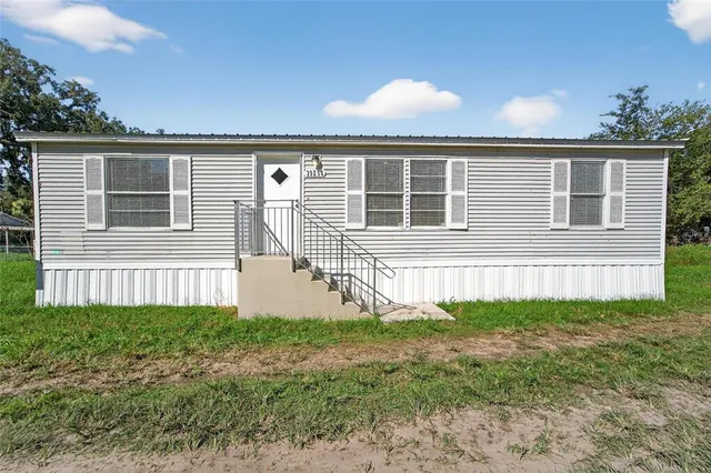 front view of a house and a yard