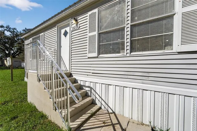 a view of a balcony with wooden floor