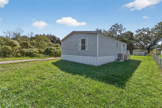 a view of backyard with garden and entertaining space