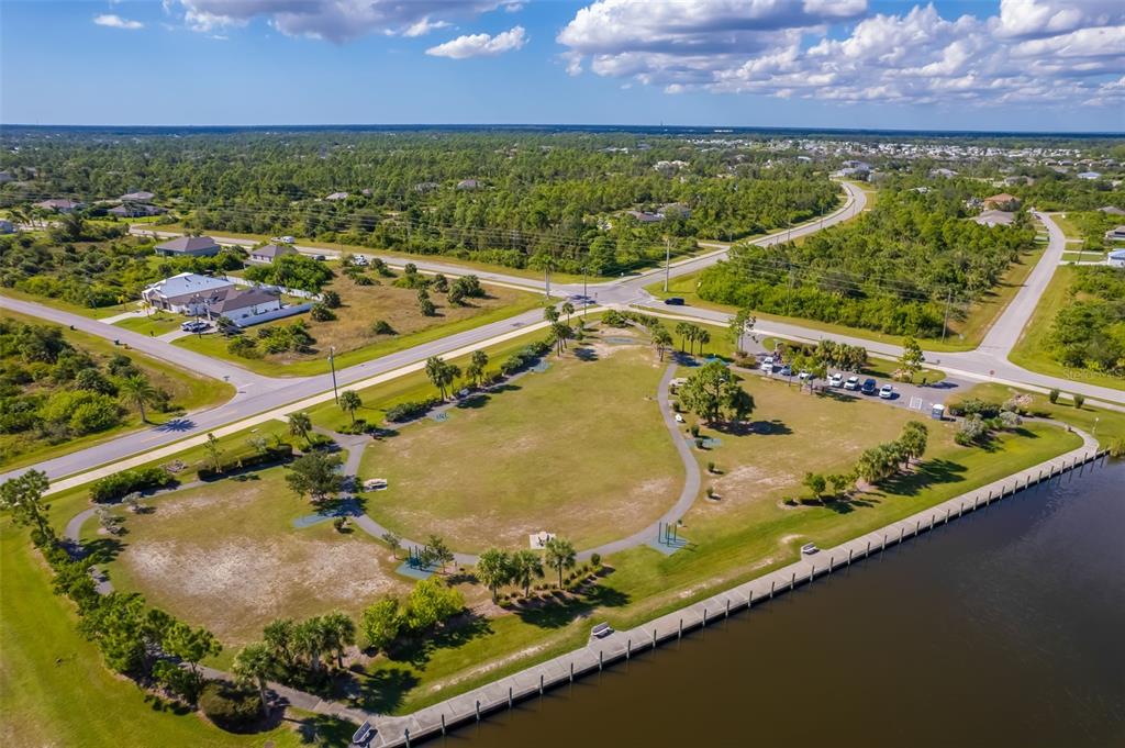 14265 Imlay Avenue Port Charlotte, FL 33981 - Photo 15 of 22 a view of a swimming pool with a yard