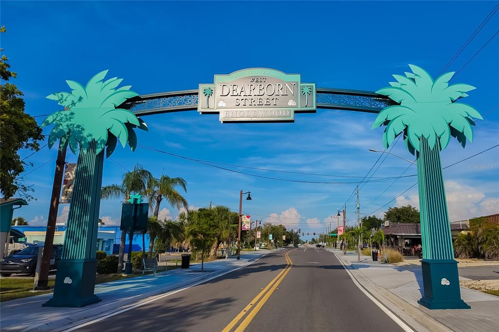 14265 Imlay Avenue Port Charlotte, FL 33981 - Photo 7 of 22 a view of a street with potted plants