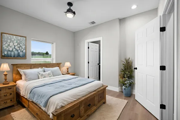 a bedroom with bed and a window