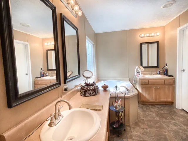 a bathroom with a sink vanity and a mirror