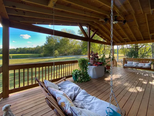 a view of a two chairs in the balcony