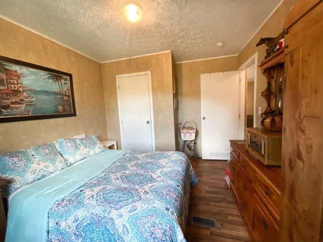 a bedroom with a large bed and a walk in closet