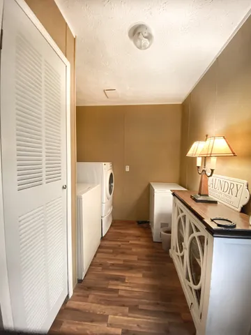 a view of a hallway with washer and dryer