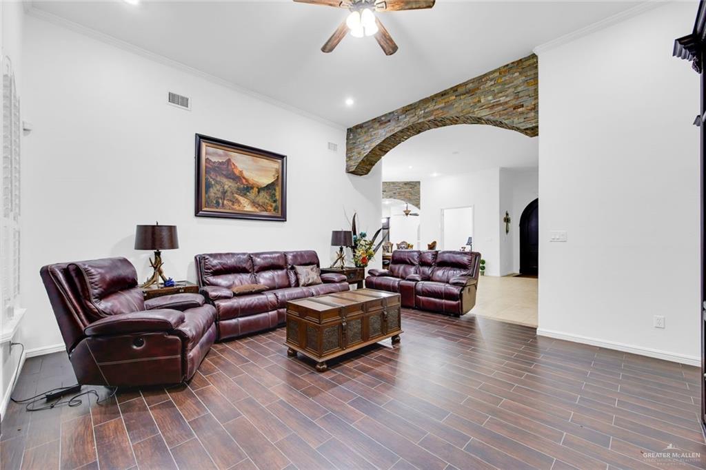 2405 West Rhin Drive Edinburg, TX 78539 - Photo 11 of 26 a living room with furniture and a wooden floor